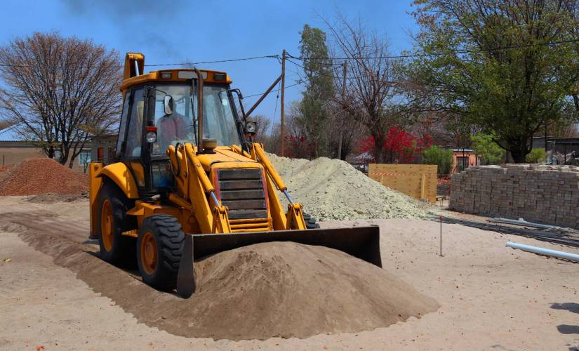 man operating a bulldozer on site