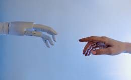 A human hand reaching out to a robot hand