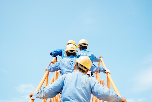 men climbing a ladder; safety culture