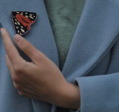 The new Humane AI pin, about the size of a lapel pin