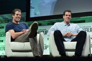 Tyler and Cameron Winklevoss on stage in 2015.
