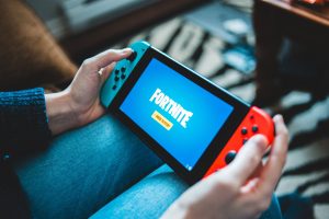 A gamer plays Fortnite on a Nintendo Switch