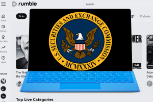 Rumble: 'active and ongoing' SEC investigation into video platform. Image of US SEC logo of eagle on blue circle and yellow outer circle inside laptop with black and white screenshot of Rumble platform.