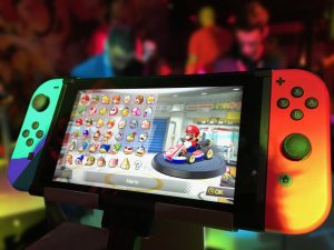 Nintendo Switch Console with Mario Kart on screen