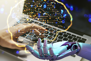 Artificial intelligence vs machine learning what's the difference. Robot hand holds machine learning brain with laptop in the background