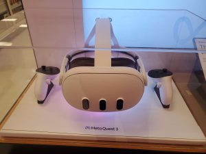 An image of a Meta Quest 3 headset in a display case.