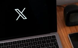 X logo on laptop