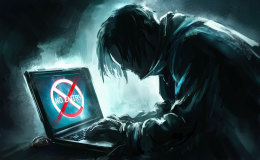 a dark silhouetted figure hunched over a laptop with a no entry sign on their screen