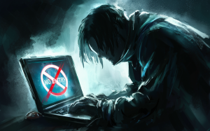 a dark silhouetted figure hunched over a laptop with a no entry sign on their screen