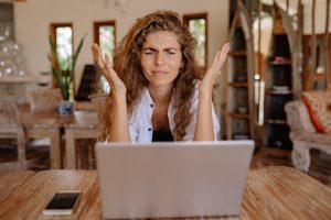 Frustrated woman at devices