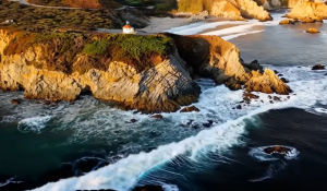 A rugged coast line with waves crashing against rocks in a screenshot from a video generated by Sora AI