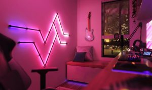 Photo of a games room lit in pink by Nanoleaf lighting