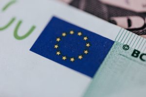 EU flag on a Euro banknote / EU Commission breached data rules with use of Microsoft software