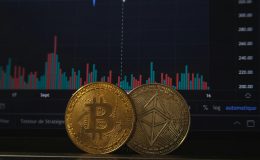 bitcoin cryptocurrency coins in front of market graph