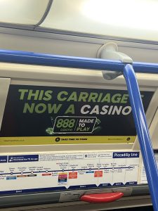 888 advert on London Underground, advertisement reads 'This carriage is now a casino'