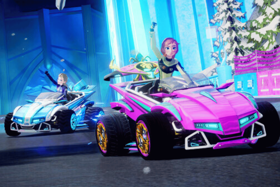 Gameloft considers changes to Disney Speedstorm monetization after outcry. An image showing two animated characters, each driving a stylized race car. The setting appears to be a virtual race track with elements of a fantastical or futuristic world, including an icy gate and neon-lit buildings in the background. The car on the left is colored in blue tones with yellow highlights on the wheels, while the one on the right is pink with yellow and purple accents. Both cars have a sporty, aerodynamic design indicative of high-speed racing games. The characters exude a sense of excitement and competition, signaling an action-packed racing experience.