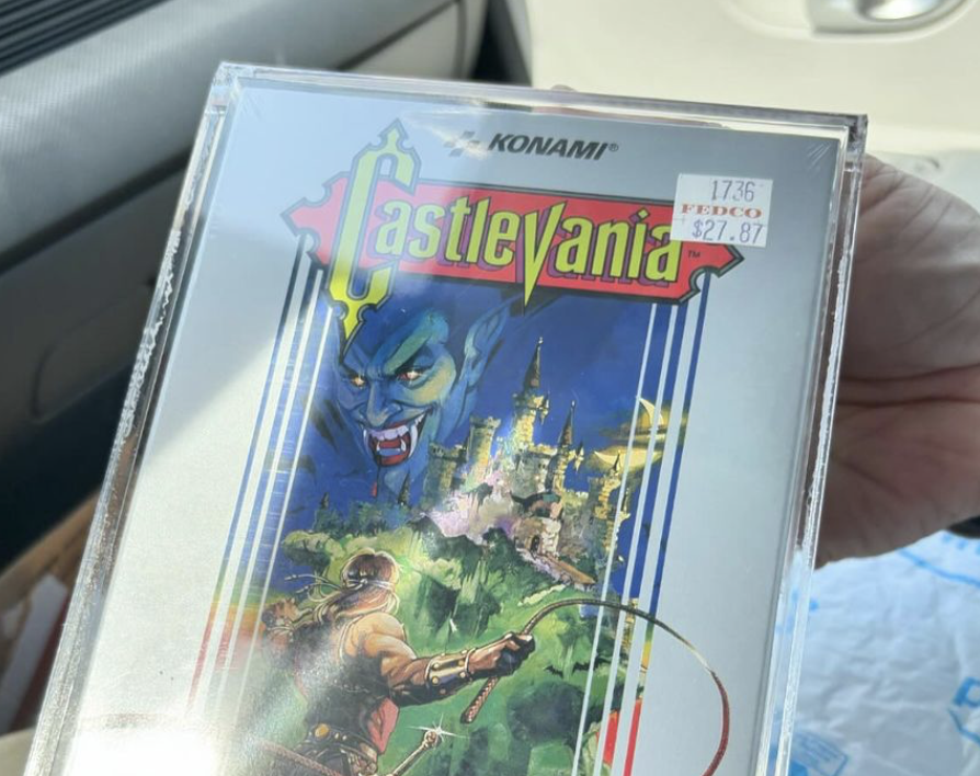 Person holding 1987 copy of Castlevania which is sealed