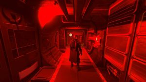 The popular Star Wars Mandalorian stands in a corridor lit by red lighting