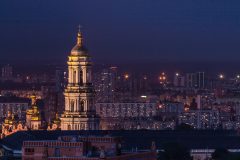 Kyiv skyline in Ukraine, showing buildings in the forefront and backdrop