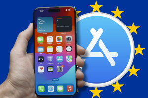 iOS 17.5 lets EU iPhone users to download apps directly from websites. An image of a person holding an iPhone with the screen visible, displaying the home screen with various app icons. The phone is superimposed over a larger icon representing the App Store, which is in turn in front of a background stylized with the European Union flag, consisting of a circle of gold stars on a blue field. The image suggests a feature of iOS 17.5 that allows European Union iPhone users to download apps directly from websites, which is a departure from the previous requirement of downloading apps exclusively through the App Store.
