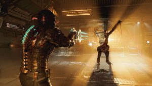 Dead Space's hero, Isaac Clark, readies a futuristic cutting tool to dispatch a hideous space monster in Dead Space (remake)