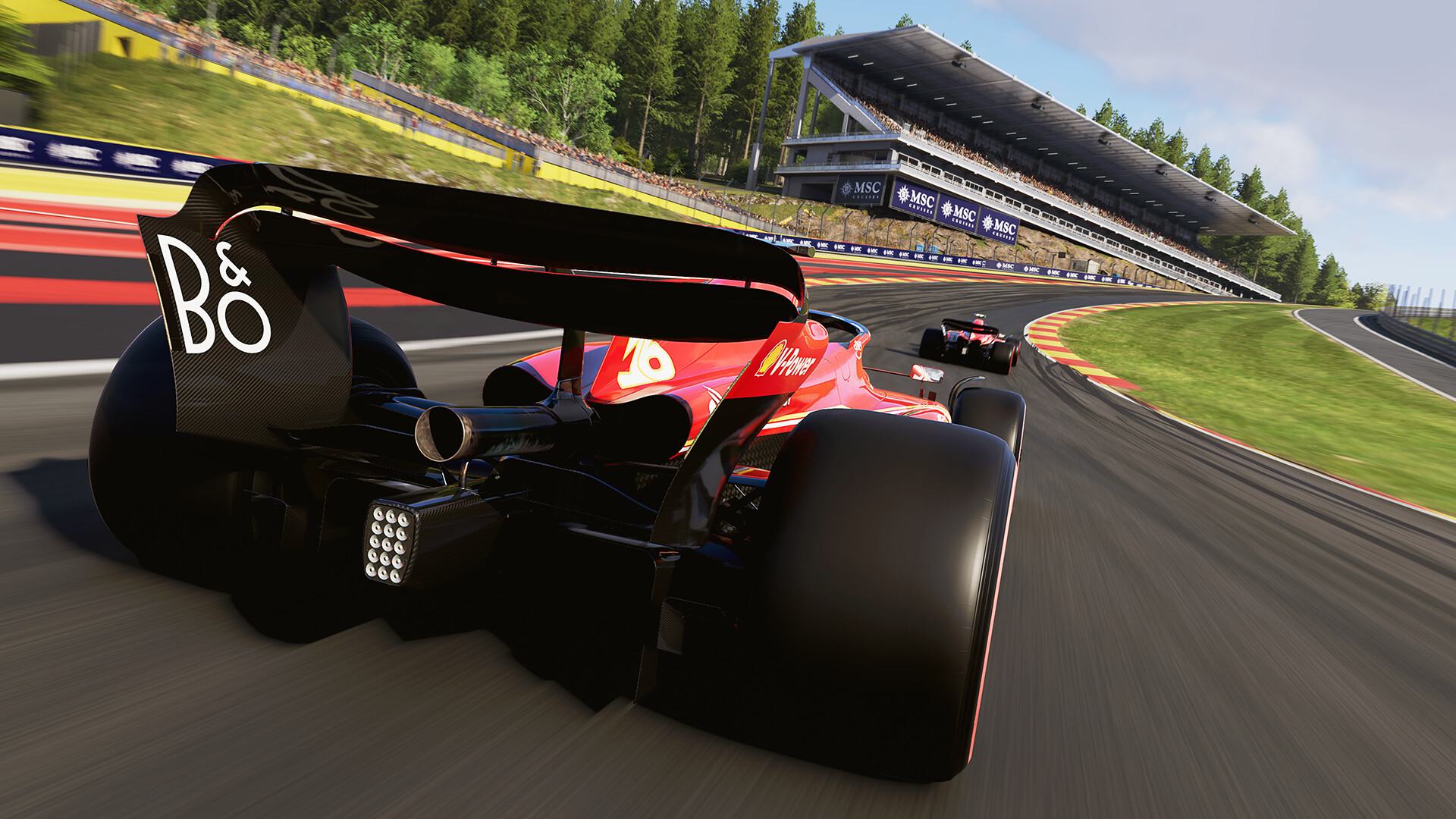 The No. 16 Ferrari of Charles LeClerc approaches the formidable Eau Rouge uphil turn at the Circuit of Spa-Francorchamps in Belgium, in the F1 24 video game.
