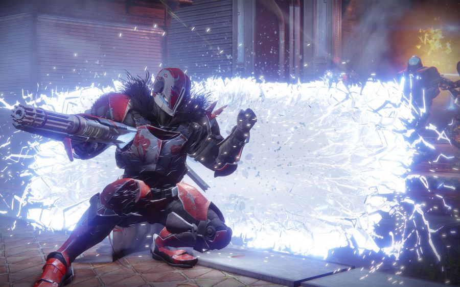 A Guardian in Destiny 2, wearing futuristic armor and carrying a large laser rifle, sprints into action as a large blue electrical explosion discharges behind him.