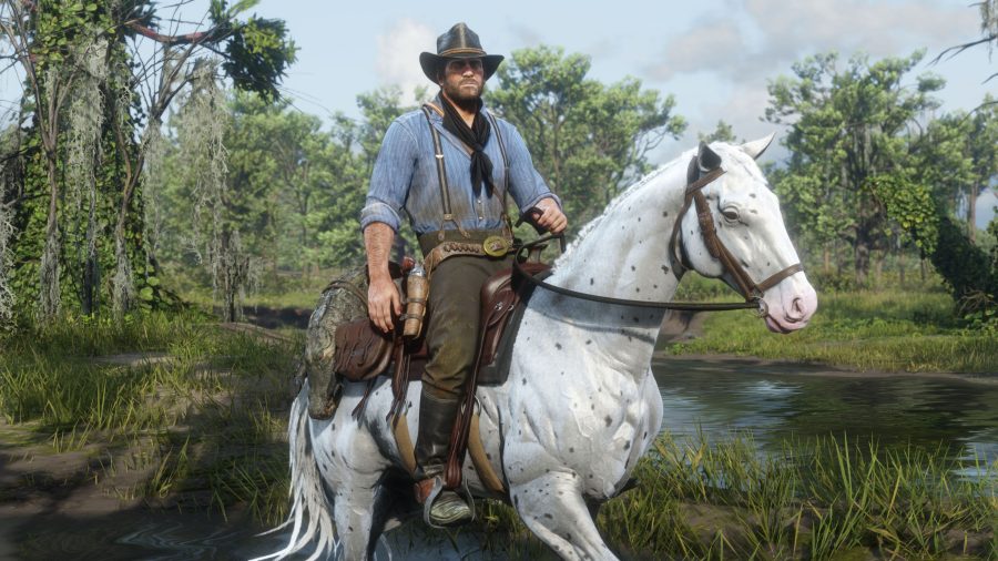 Arthur Morgan, protagonist of Red Dead Redemption 2, astride a white horse as he appears in the game