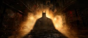 Batman's looming shadow in an alleyway full of rats