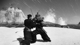 Two samurai battle in a black and white film style on a beach