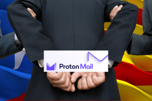 ProtonMail under fire for 'sharing user data' with Spanish police. This image features a man in a business suit with crossed arms, standing in front of a background composed of the Spanish flag. He is holding a sign with the ProtonMail logo and a graph, symbolizing the company's involvement in a controversy regarding sharing user data with Spanish authorities.