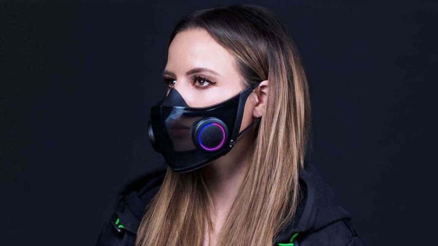 a woman with long blonde hair wears a Razer Zephyr facemask. It has LED lights on the filters.