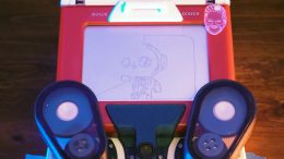 An image of an Etch a Sketch with motors attached