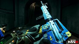 first-person view of the player brandishing a blue and yellow Fallout-themed M16 in Call of Duty Modern Warfare III multiplayer