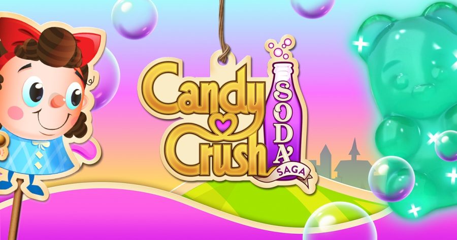 the cover art for candy crush soda saga. it's bright and pastel in colour and features a cartoonish person on the left and a giant green gummy bear on the right. in the center is the logo of the game.