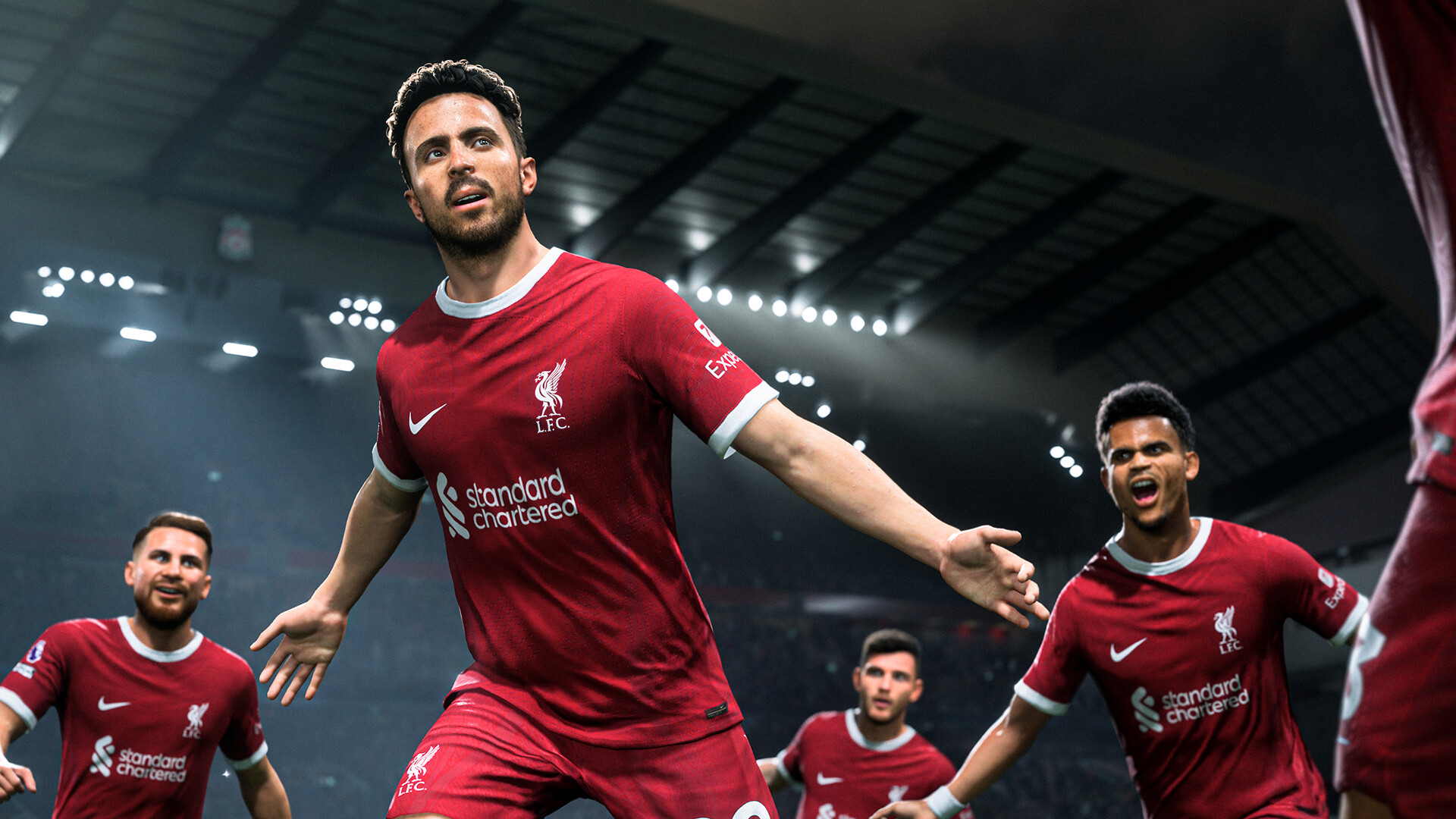 Liverpool players celebrating a goal, running with arms spread wide in EA Sports FC 24