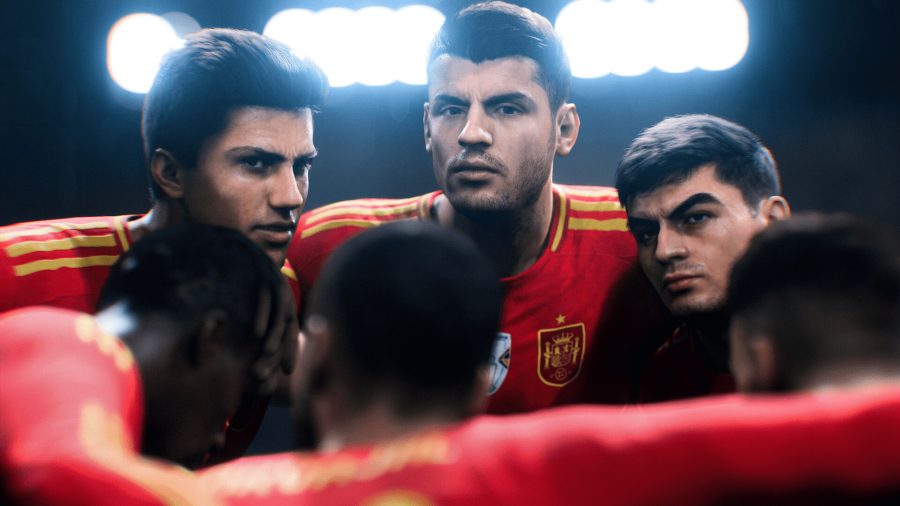 three players in red kits huddle up under stadium lights in EA Sports FC 24