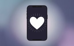 A minimalist illustration of a smartphone screen displaying a simple, white love heart, conveying a sense of pure and uncomplicated affection. The background is a soft gradient of blue and purple, creating a calming atmosphere. The heart is gently pulsating, radiating warmth and love.