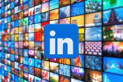 LinkedIn settles ad overcharging claims for $6.6M. The image displays a large collection of colorful, multimedia screens forming a mosaic background, with the LinkedIn logo prominently featured in the center. Each screen shows a different image, ranging from urban landscapes and natural scenes to abstract and technological visuals, symbolizing the vast and diverse content accessible through the platform.