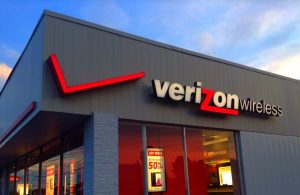 The Verizon logo on the outside of a Verizon Wireless store