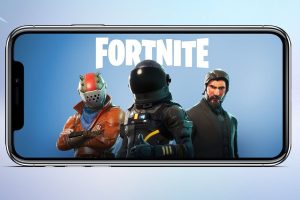 a picture of an iphone with some fortnite key art on the screen - the fortnite logo appears at the top and three characters are beneath it looking out at the viewer