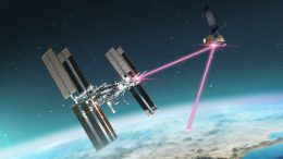 A graphic representation of a laser communications relay between the International Space Station, the Laser Communications Relay Demonstration spacecraft, and the Earth.