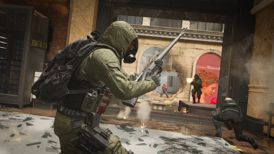 a fighter in hazmat gear reloads his weapon in Call of Duty: Modern Warfare III's multiplayer mode.
