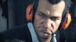 frank west, hero of the original Dead Rising, wearing headphones inside a helicopter at the beginning of the zombie-horror survival game