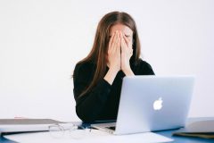 woman covering her face over failed startup