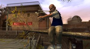 Jimmy Hopkins, the protagonist of 2006's Bully for PlayStation 2, readies his slingshot to fire on an unsuspecting target