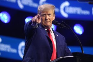 Former President of the United States Donald Trump speaking with attendees at the 2023 Turning Point Action Conference at the Palm Beach County Convention Center in West Palm Beach, Florida.