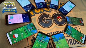 Pokemon Go update. Players phones all round in a circle with the app loaded on them.