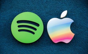 Apple and Spotify logos next to each other