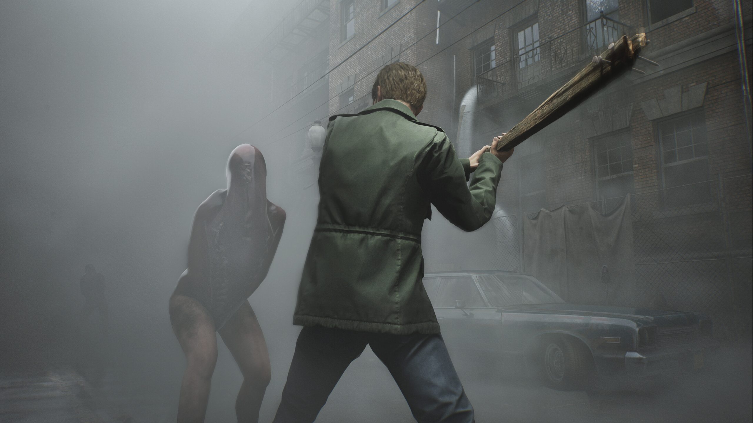 Silent Hill 2, on a foggy street the hero prepares to swing a club at some kind of nasty ghoul